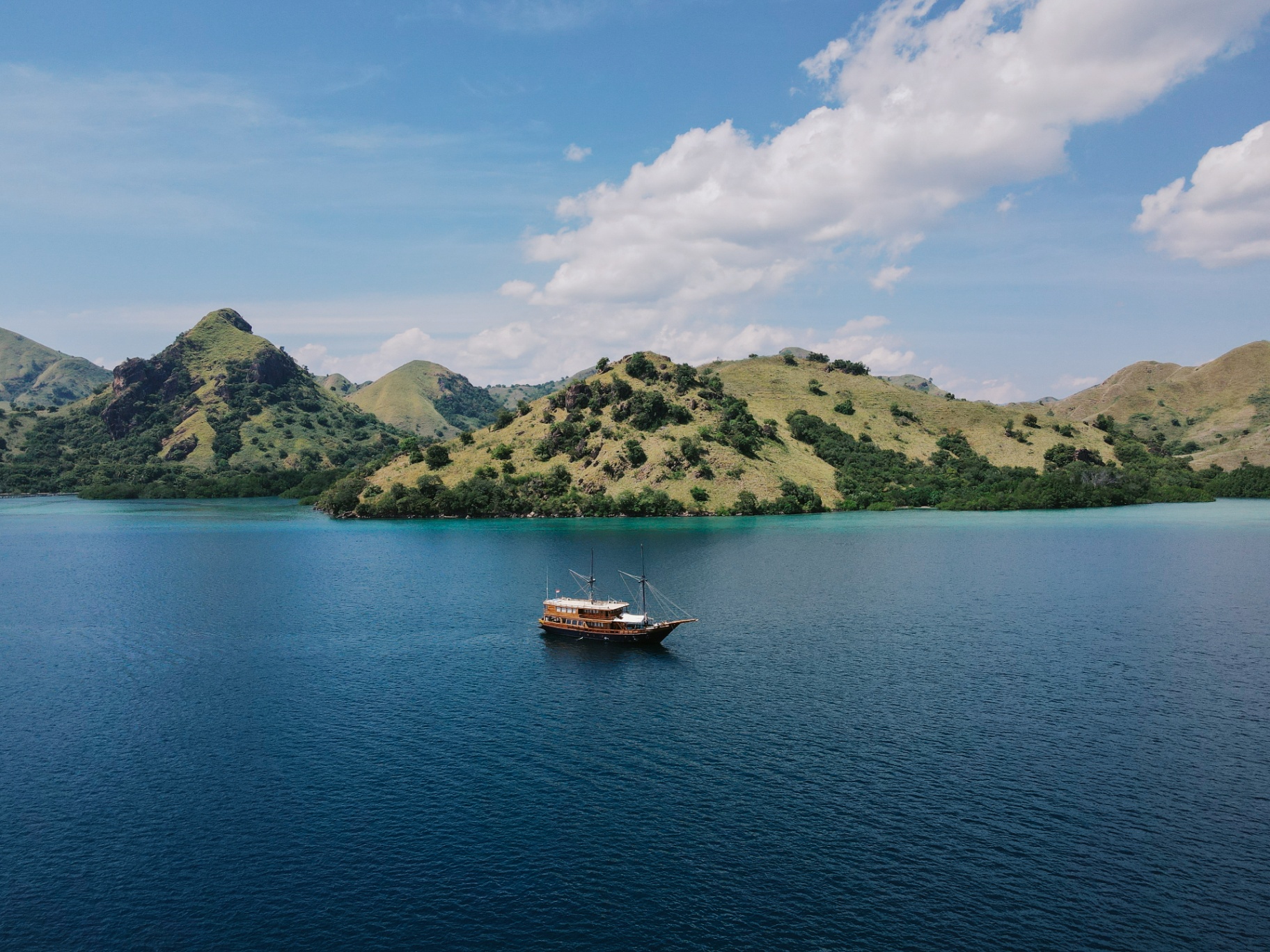 Augustine Phinisi yacht anchored near Pink Beach Komodo