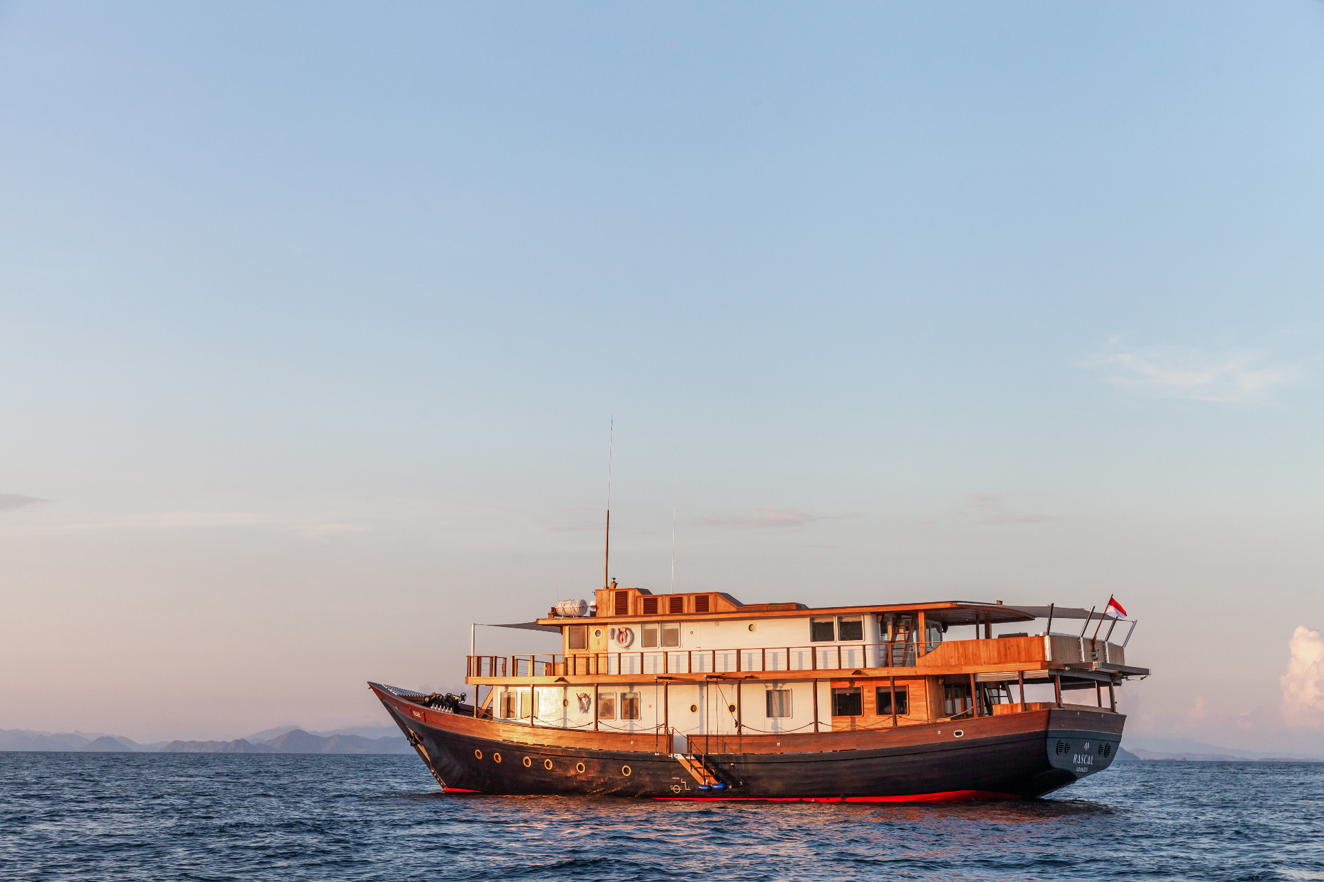 Rebel yacht anchored near Pink Beach Komodo